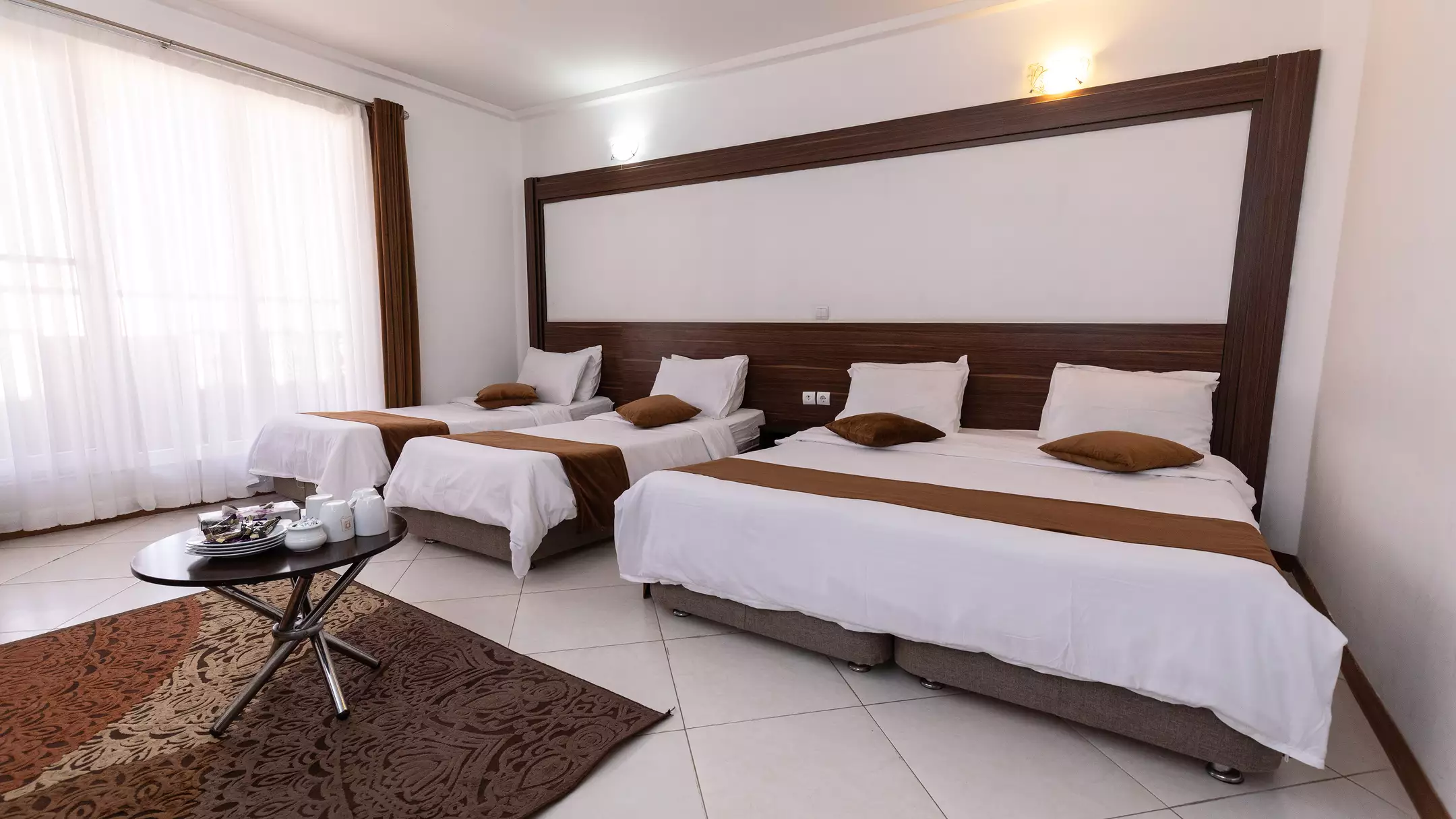 Alibaba https://cdn.alibaba.ir/ostorage/hotel-accommodation-images/67471c0510d0d5745be3d0bf_هتل پدرام - اتاق چهارتخته دبل سینگل (1).webp